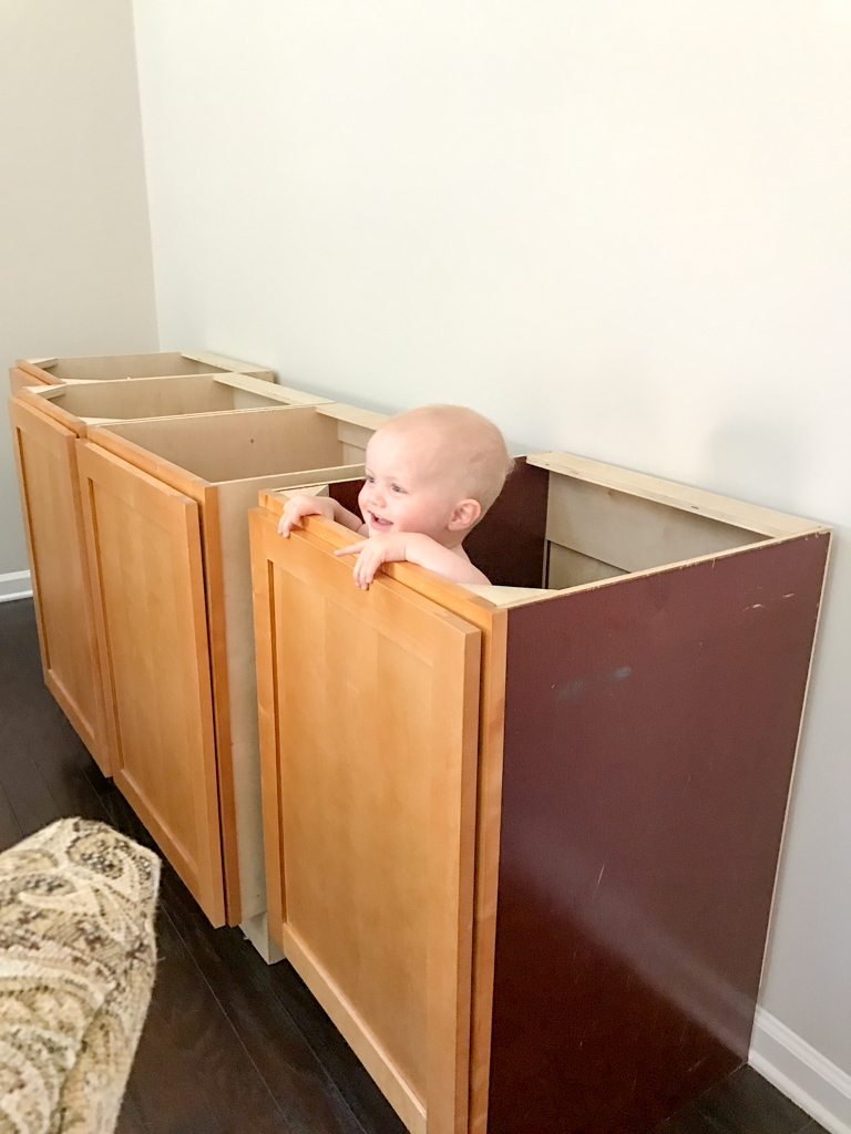 John Davis playing in the base cabinets