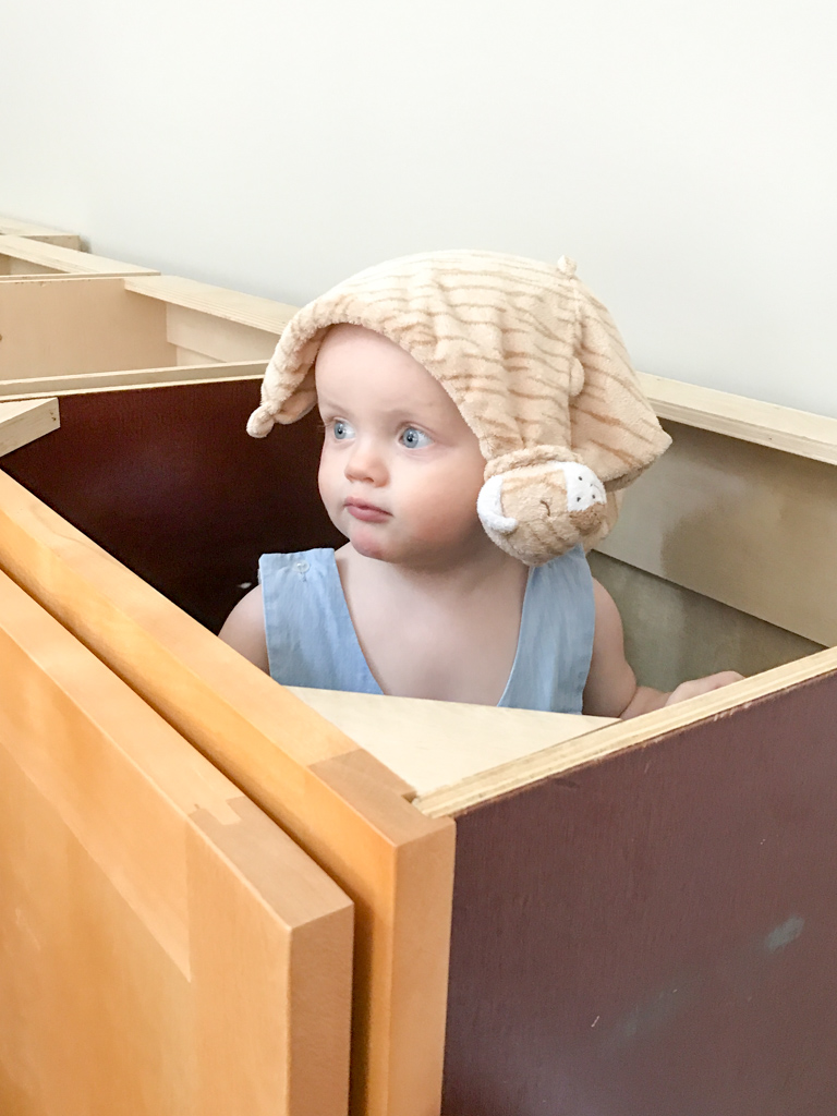 John Davis playing in the base cabinets