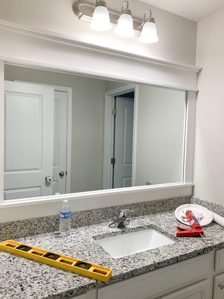 How We Framed Our Large Bathroom Mirror (WITHOUT GLUE!)