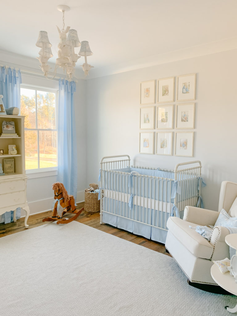 blue and white gingham tie-top curtains hanging on a curtain rod in a baby boy nursery 