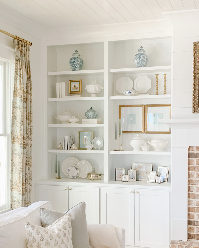 built-in shelves styled with vintage thrift store decor on a budget