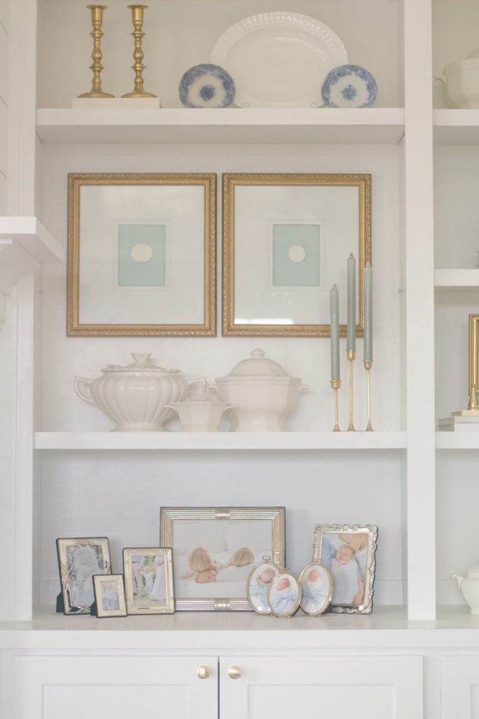 built-in shelves styled with vintage thrift store decor on a budget