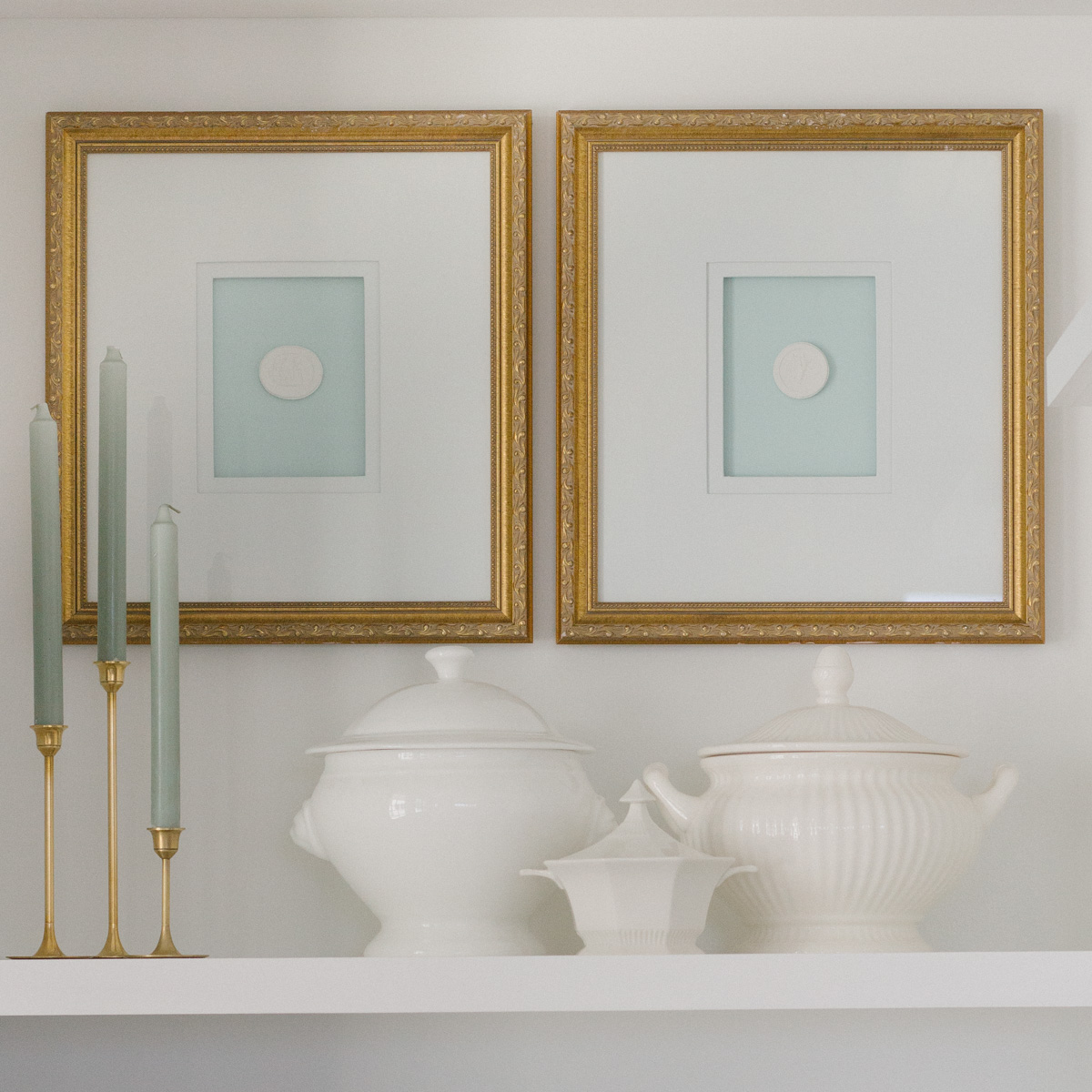 set of two DIY framed intaglios on white shelves