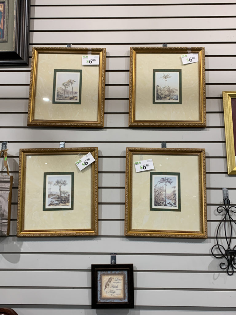set of four gold picture frames for sale at the thrift store 