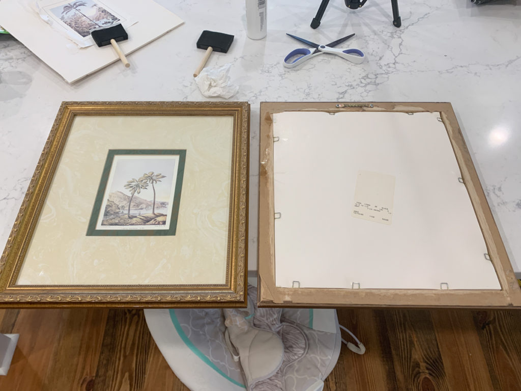 two picture frames sitting next to each other on a countertop. one is facing upward and the other is facing downward 