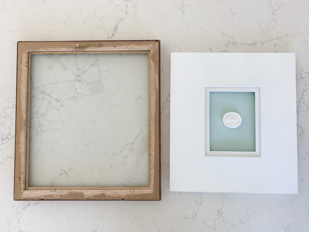 DIY framed intaglio sitting on a countertop