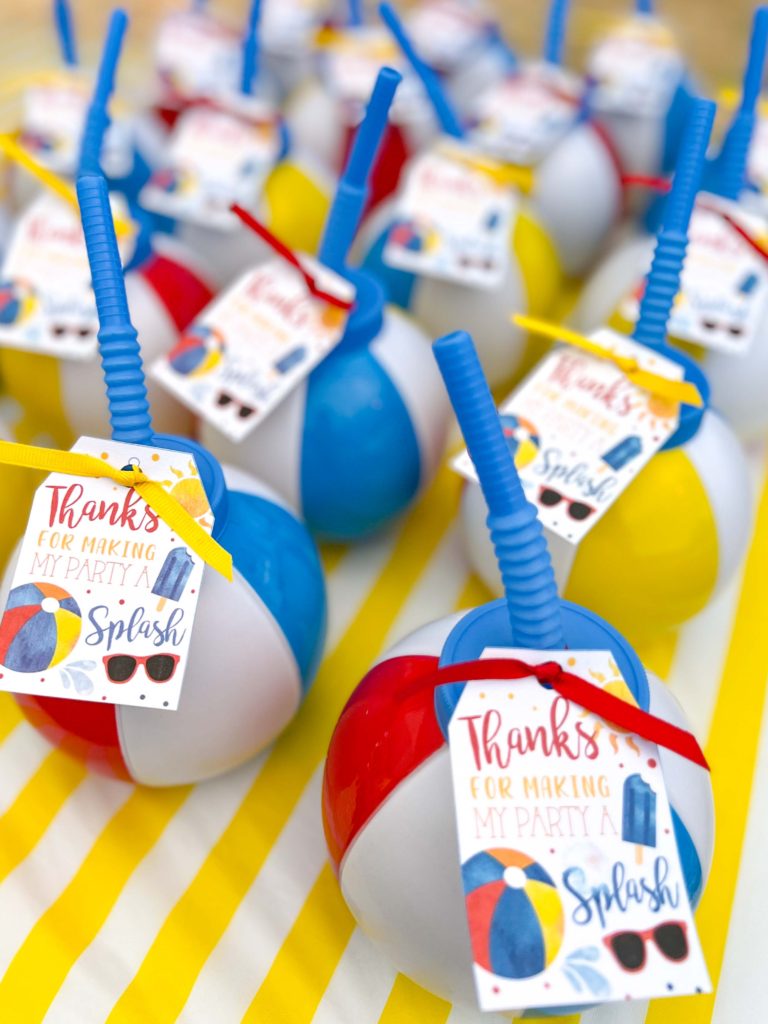 beach ball cup party favors with a thank you tag tied on with ribbon 