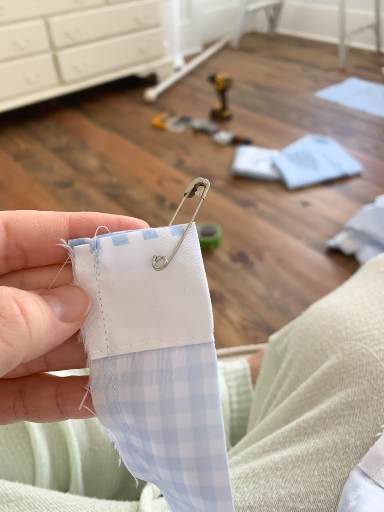 a tube of fabric with a safety pin in one end for turning the fabric the right side out 