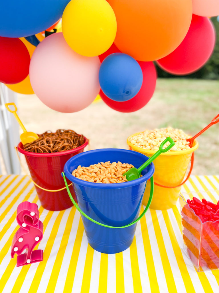 summer waterslide birthday party snack food served in sand buckets with sand shovels 