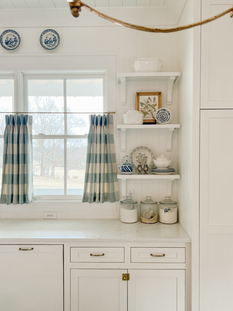 styled open shelves with corbels in a kitchen 