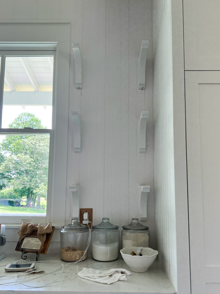 wood corbels mounted on the wall in a kitchen 