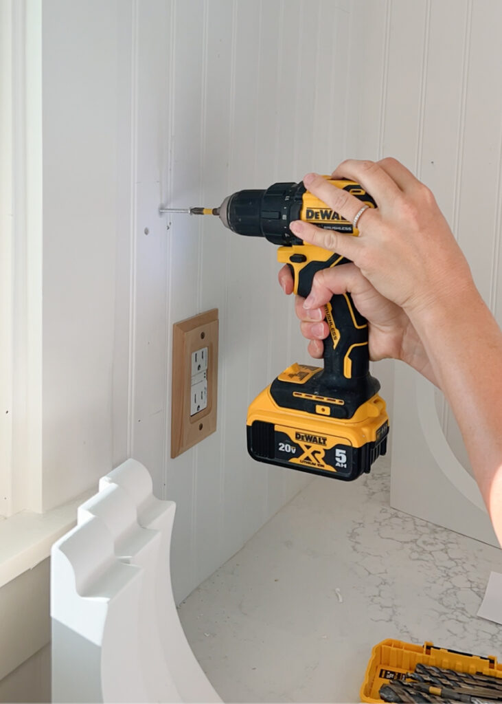 drill drilling into wall