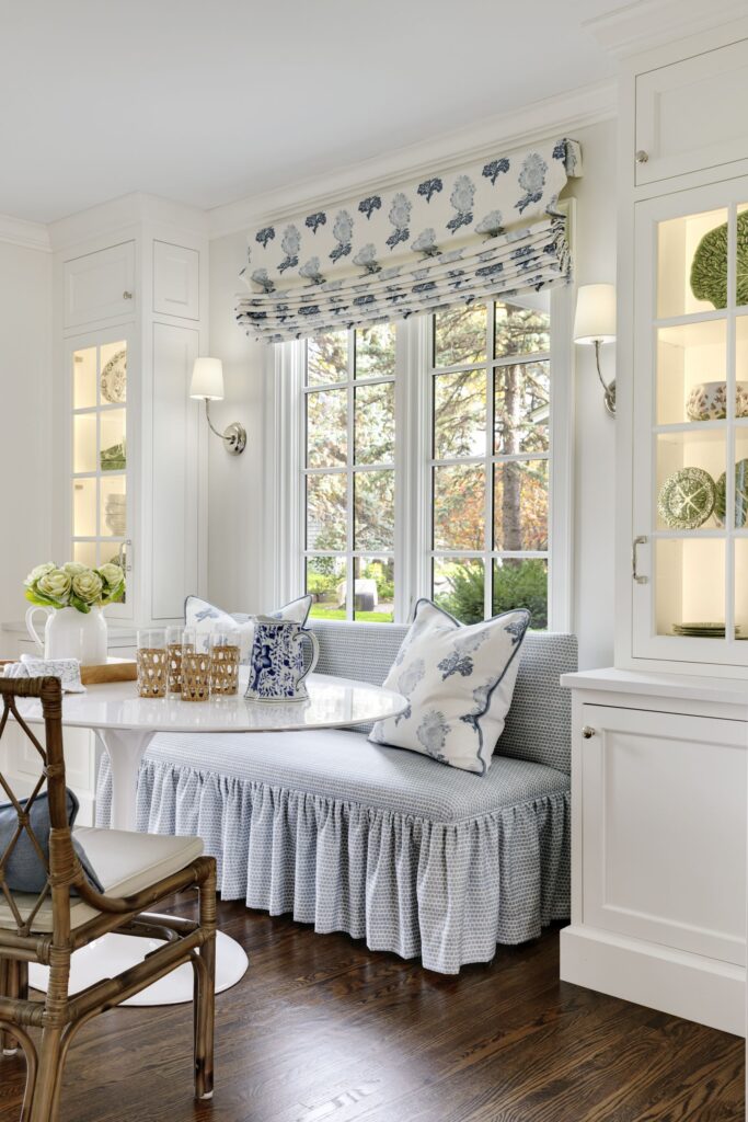 Inspiration of a custom upholstered dining banquette with a ruffled skirt in a breakfast nook of a kitchen 