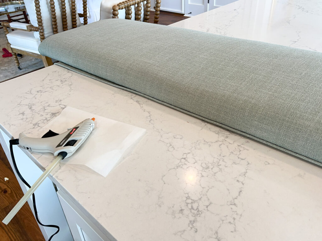 attaching piping to the seat cushion of an upholstered DIY banquette bench 