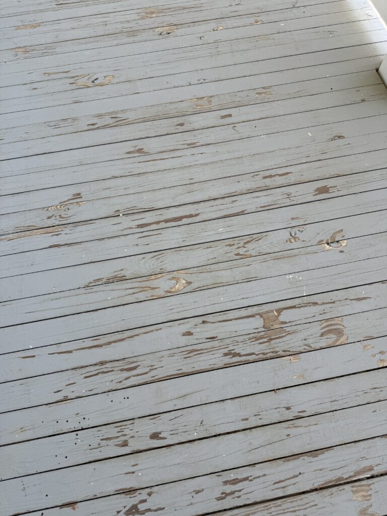 chipping and peeling paint or stain on a porch floor