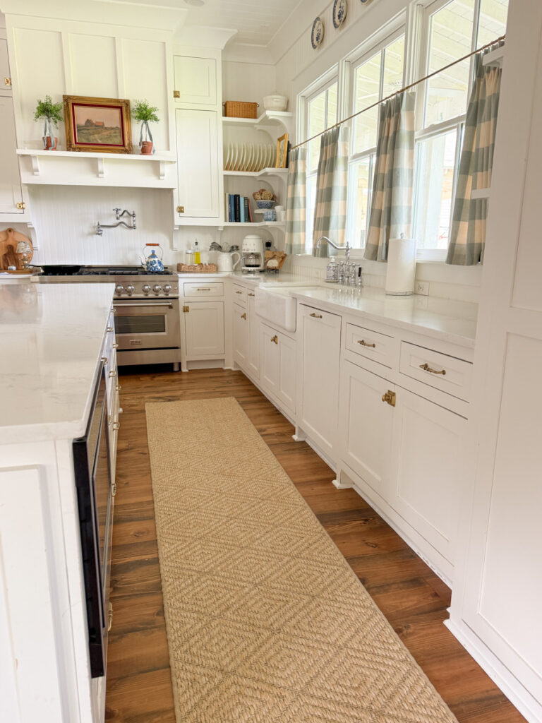 geometric sisal runner in a farmhouse kitchen with white cabinets
